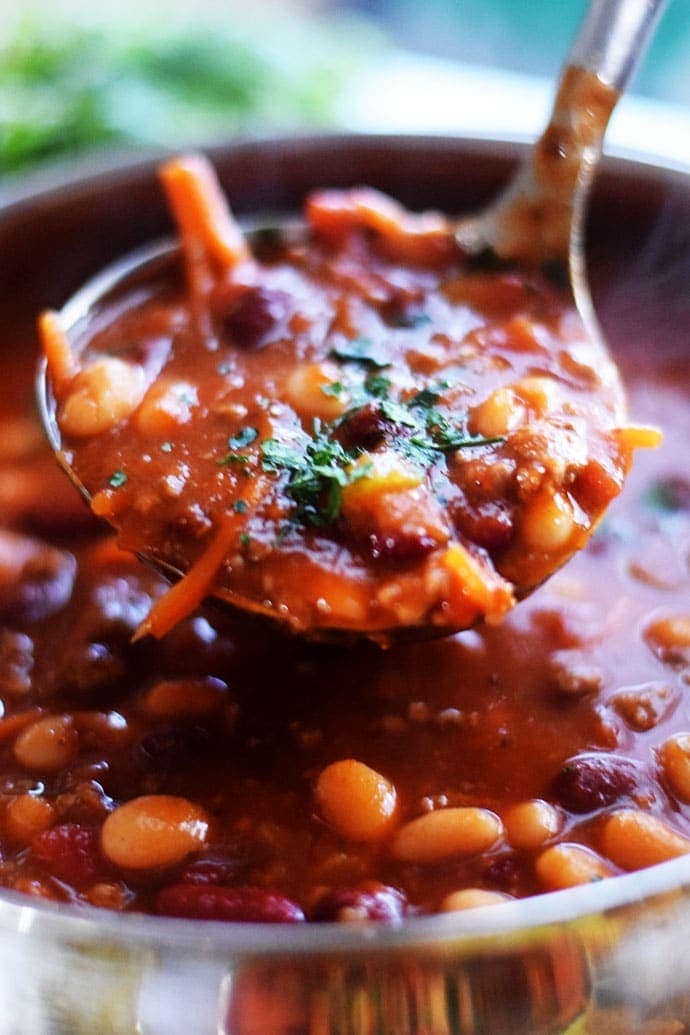 a closeup of a ladleful of this stovetop pasta fagili soup recipe