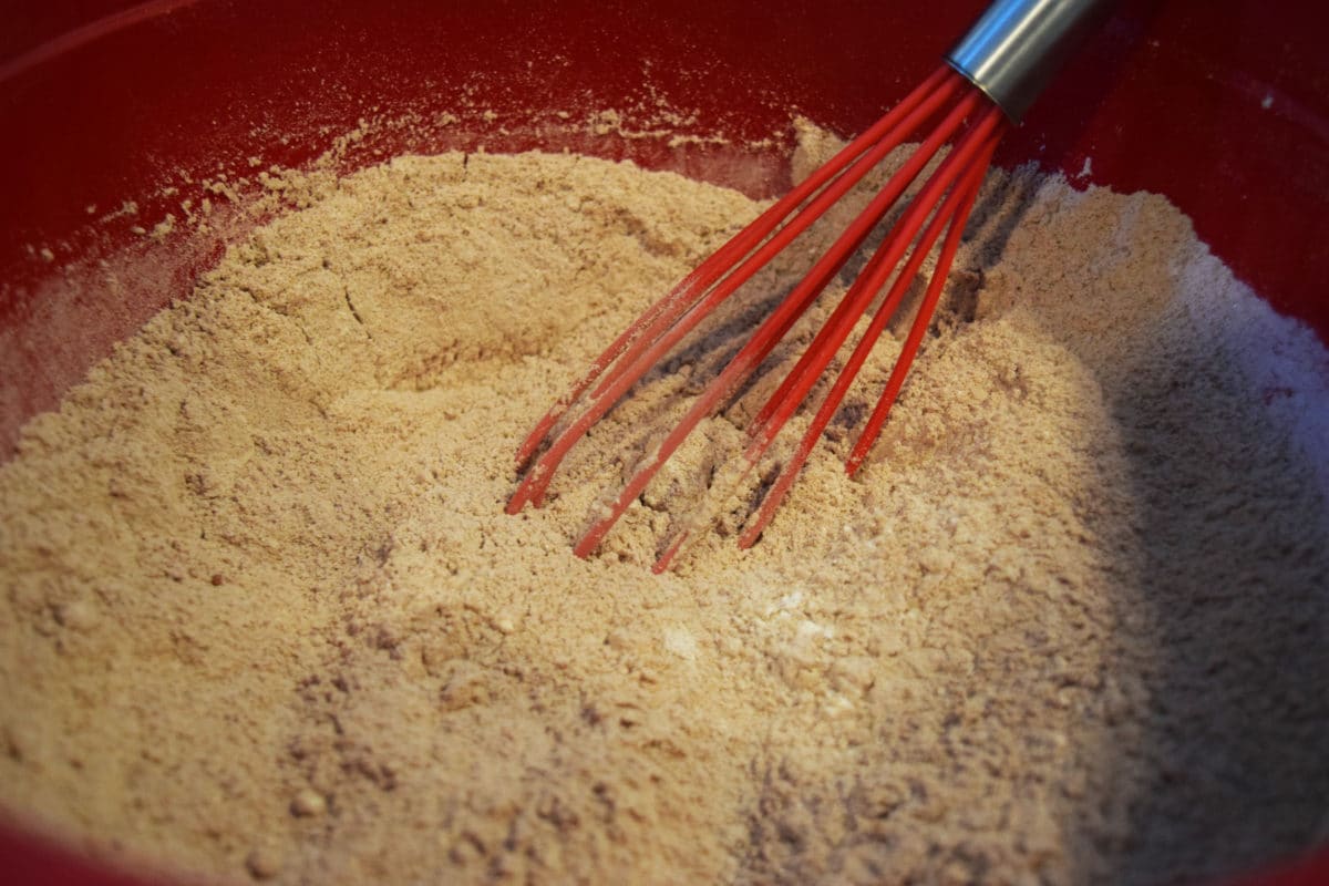Red velvet cupcake dry ingredients sifted in a bowl.