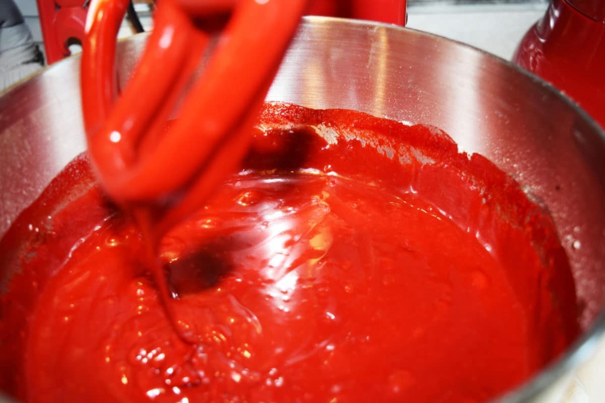 Red food coloring added to the red velvet cupcake batter.