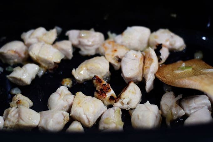 cubed chicken sautéing in a pan to be used in white chicken chili