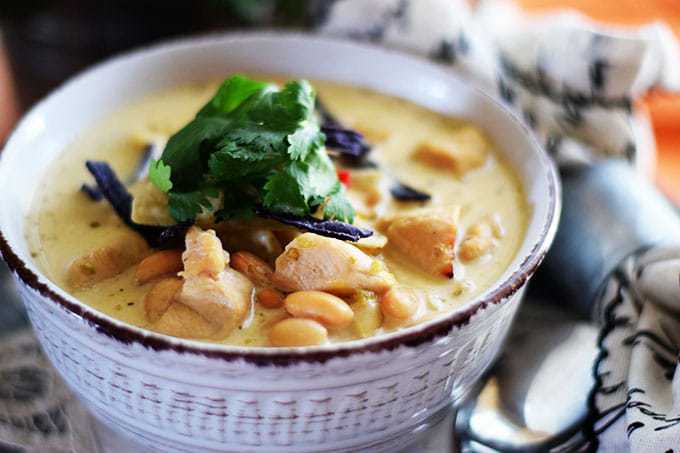 a bowl of this chicken tortilla soup topped with fresh parsley