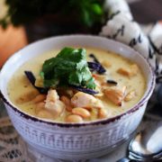 a closeup of this stovetop white chicken chili recipe garnished with fresh parsley