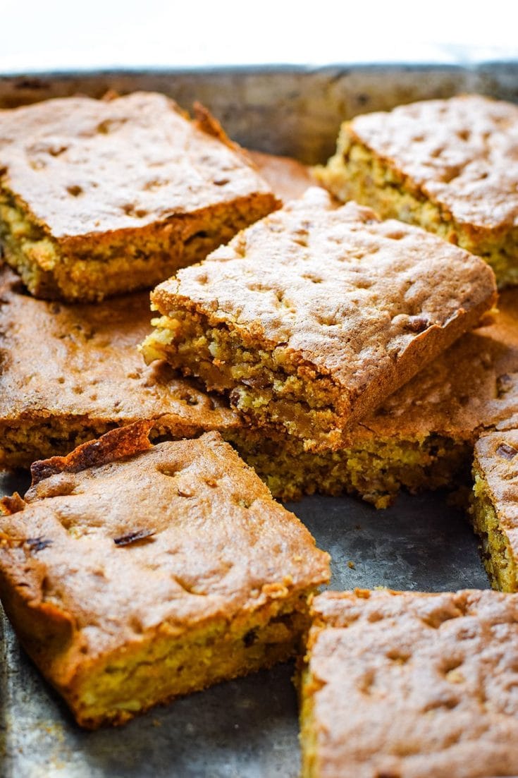 a tray of sliced pecan chewy cake bars aka pecan chewies