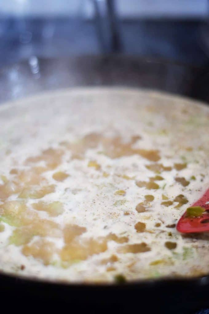 veggies with broth in skillet for Chicken and Dirty Rice Skillet