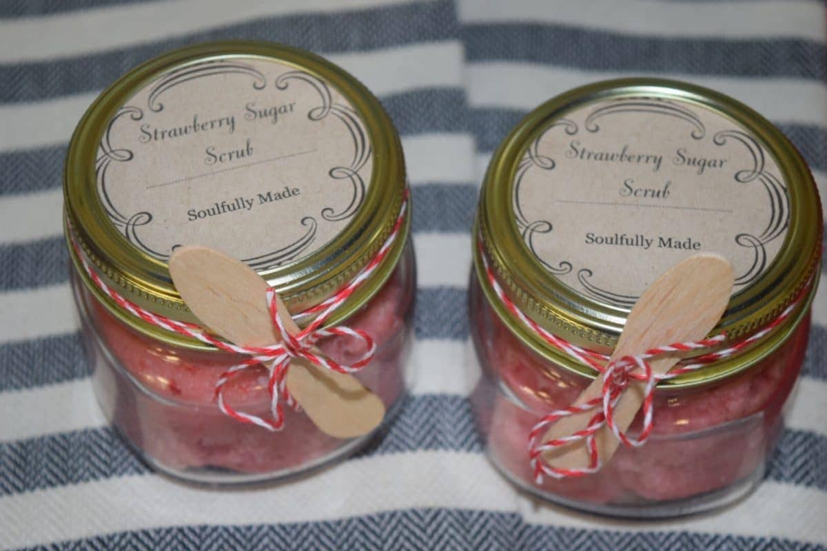 two glass jars of this homemade strawberry sugar scrub