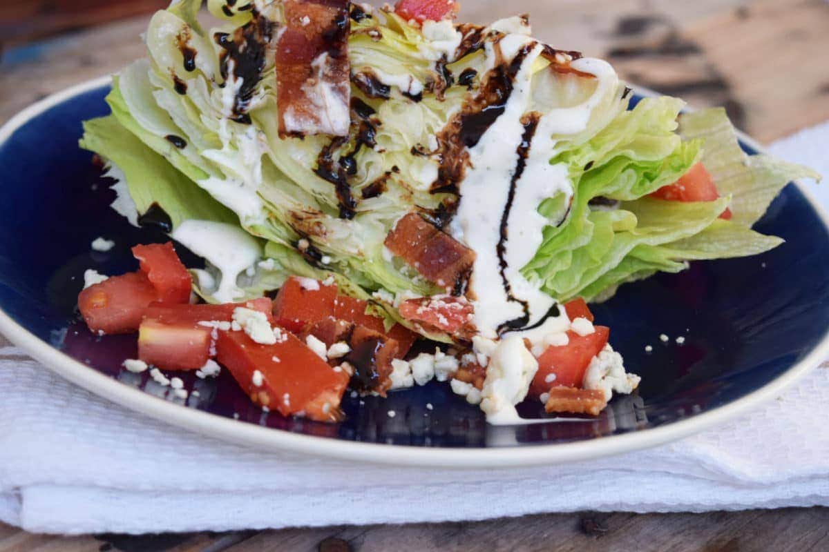 a closeup of this blue cheese ranch wedge salad with balsamic glaze