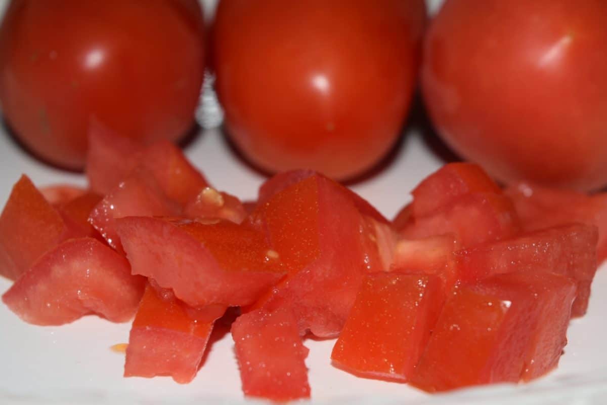 chopped fresh tomatoes on a cutting board