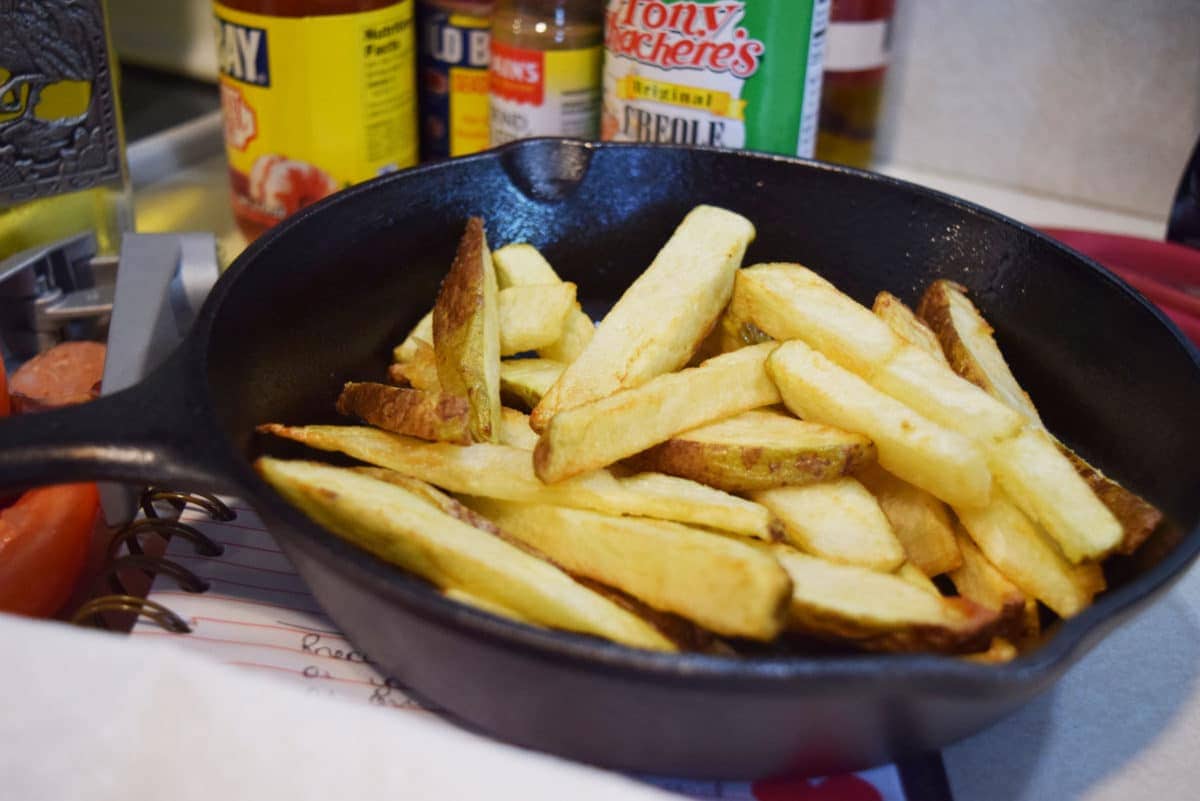 homemade thick cut french fries in a cast iron skillet 
