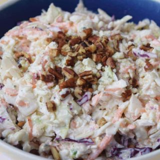 a large serving bowl filled with this homemade blue cheese coleslaw