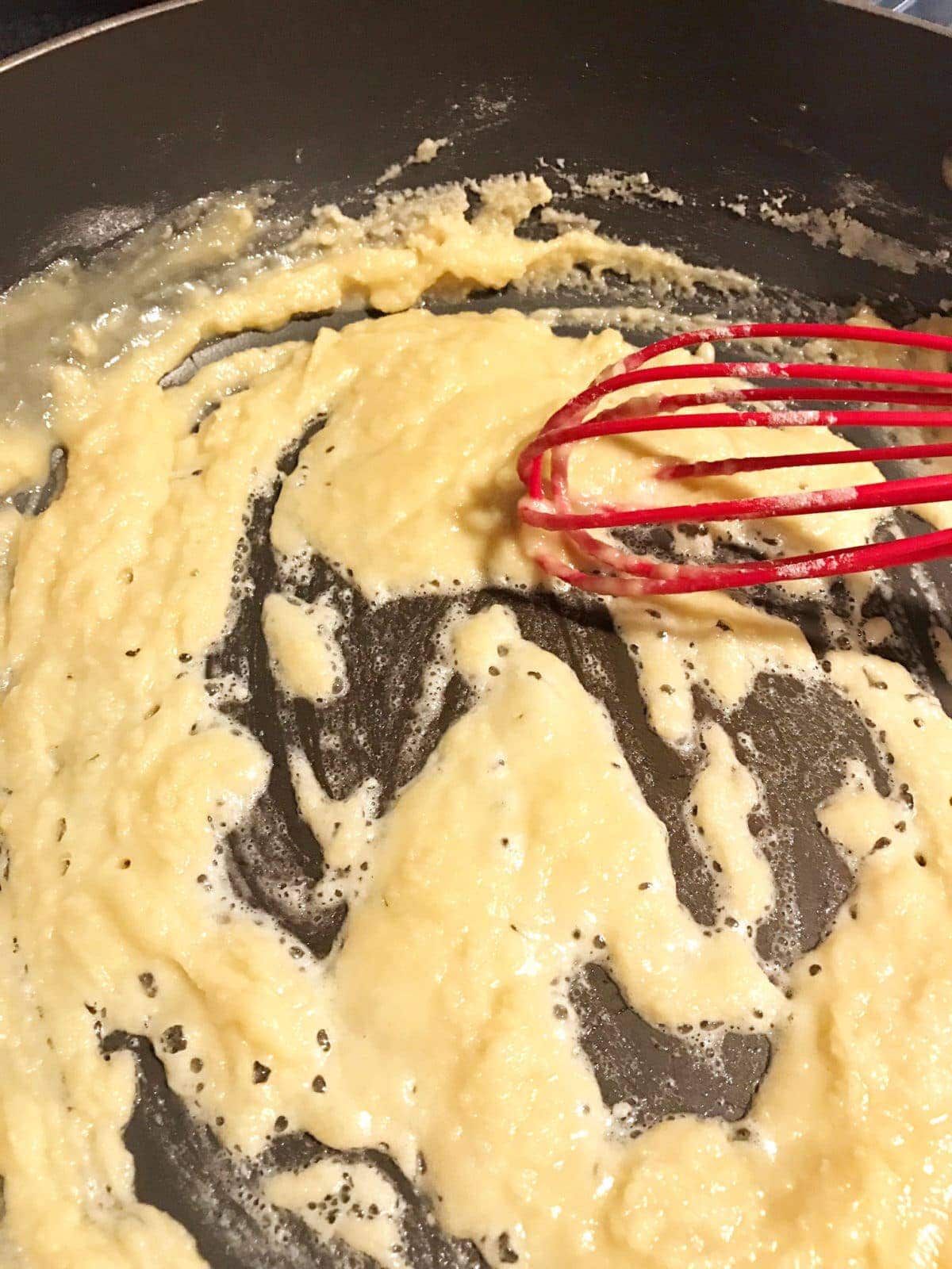 flour roux with a whisk in a pan