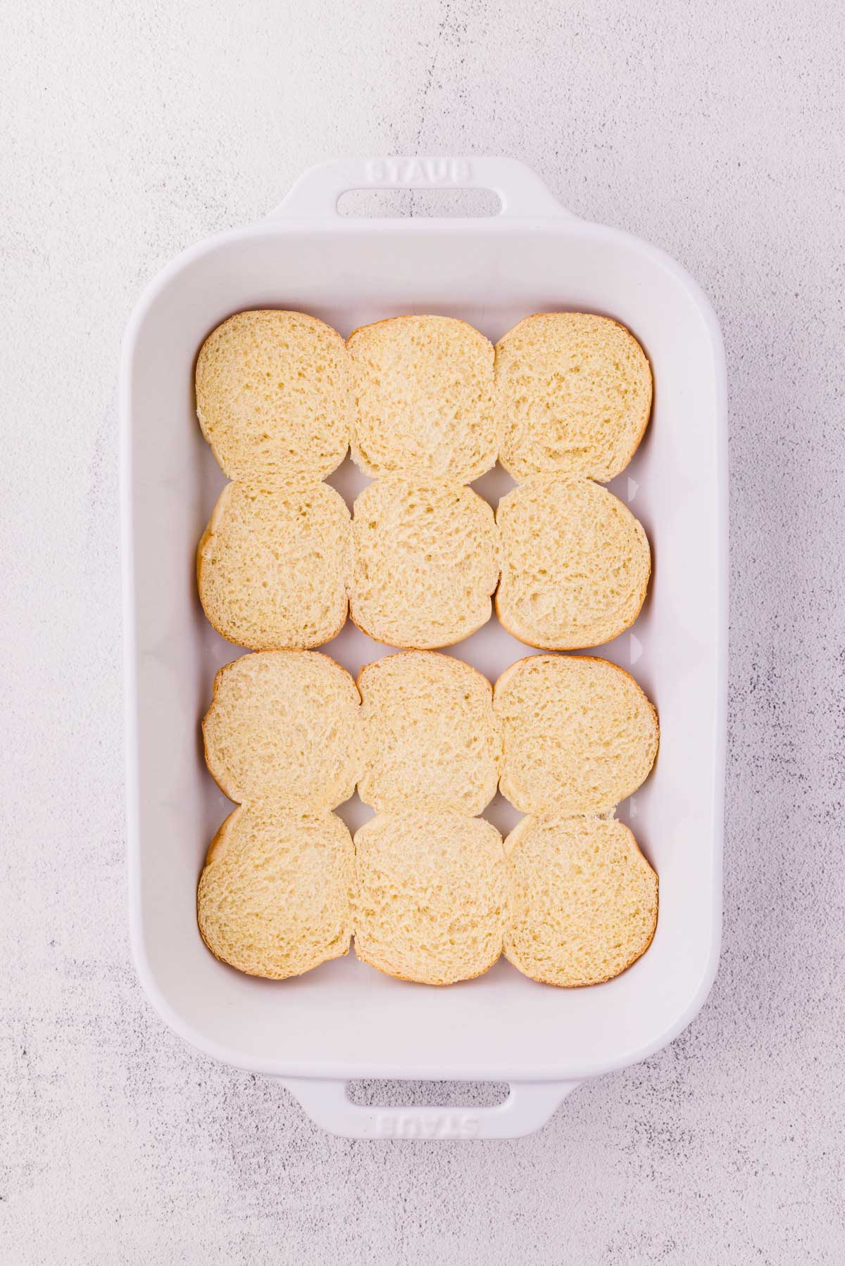 Bottom half of slider buns in a 9 X 13 pan.