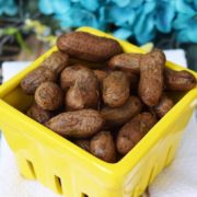 a yellow container filled with crock pot boiled peanuts