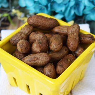 a yellow container filled with crock pot boiled peanuts