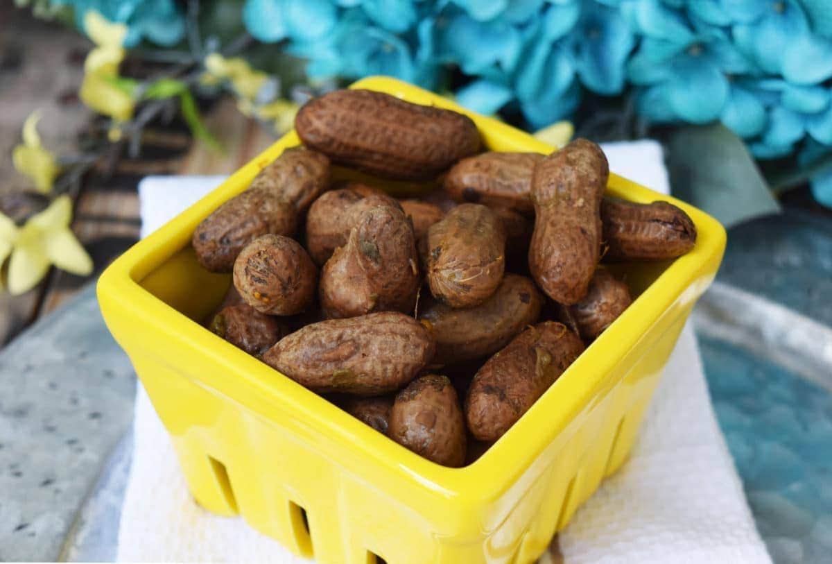 a yellow container filled with crock pot boiled peanuts