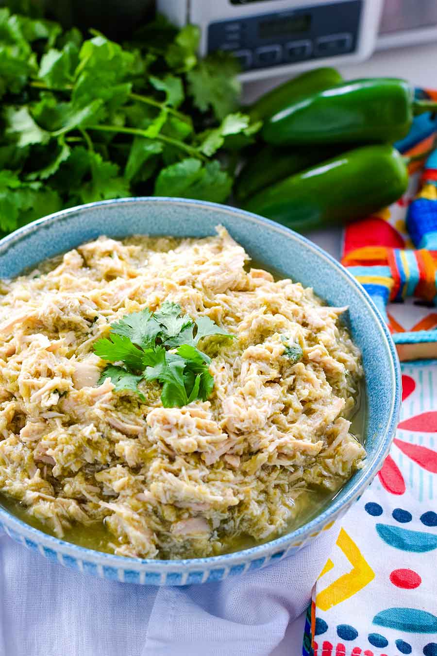 an overhead view of crock pot salsa verde chicken