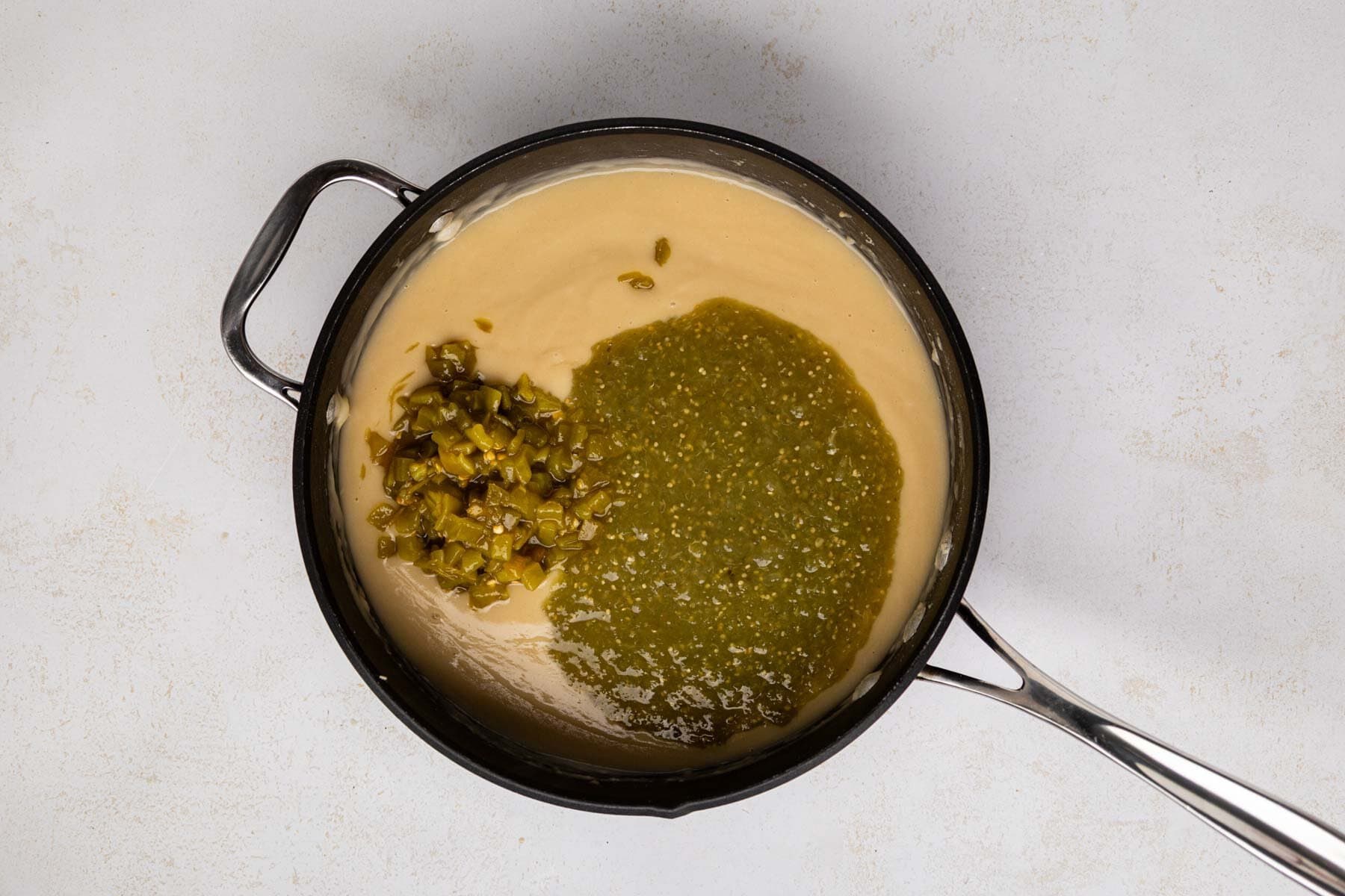 Salsa verde and green chiles added to sauce.