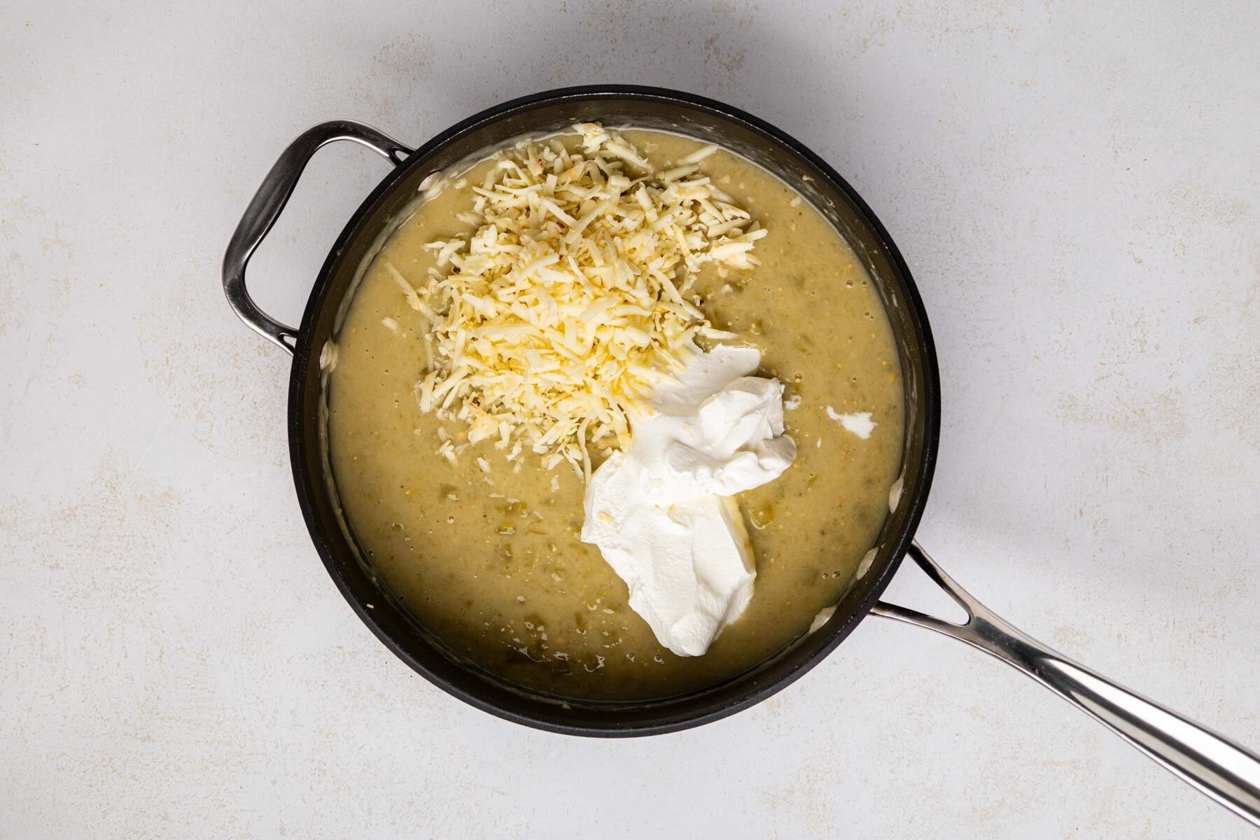 Cheese and sour cream added to sauce.
