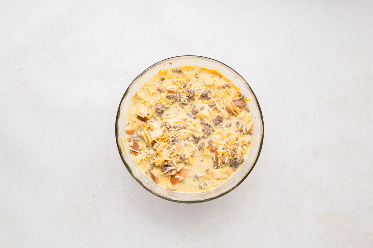 Sausage, cheese, and cubbed bread added and mixed into egg mixture.