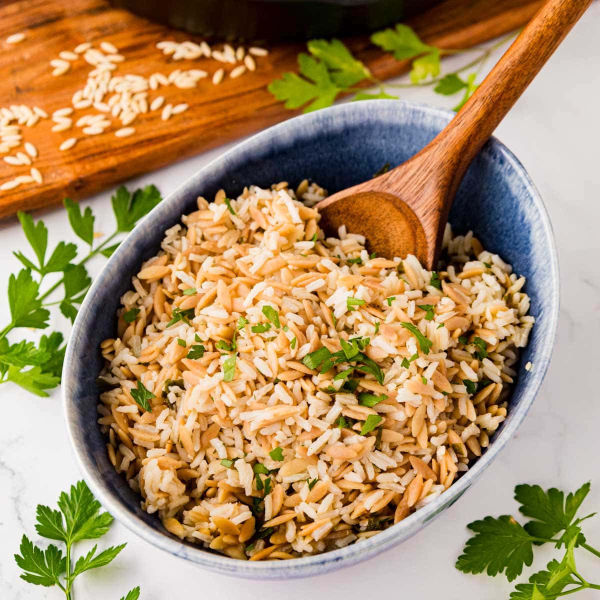 Rice pilaf in a blue serving bowl.