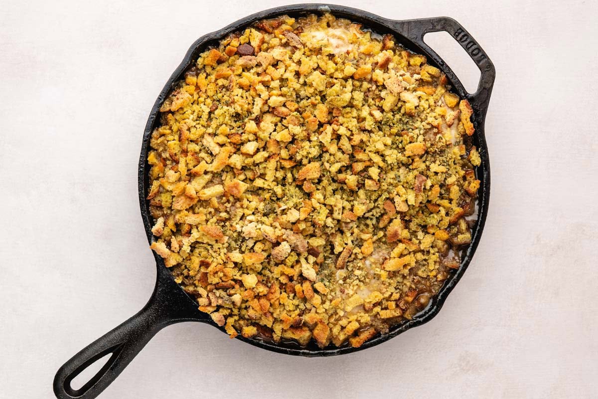 Swiss chicken casserole after baking in a cast-iron pan.