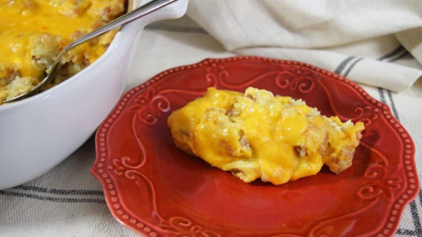 a serving of this cheesy chicken tender tater tot casserole recipe on a red plate