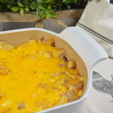 an overhead view of this cheesy chicken tender tater tot casserole recipe in a white casserole dish