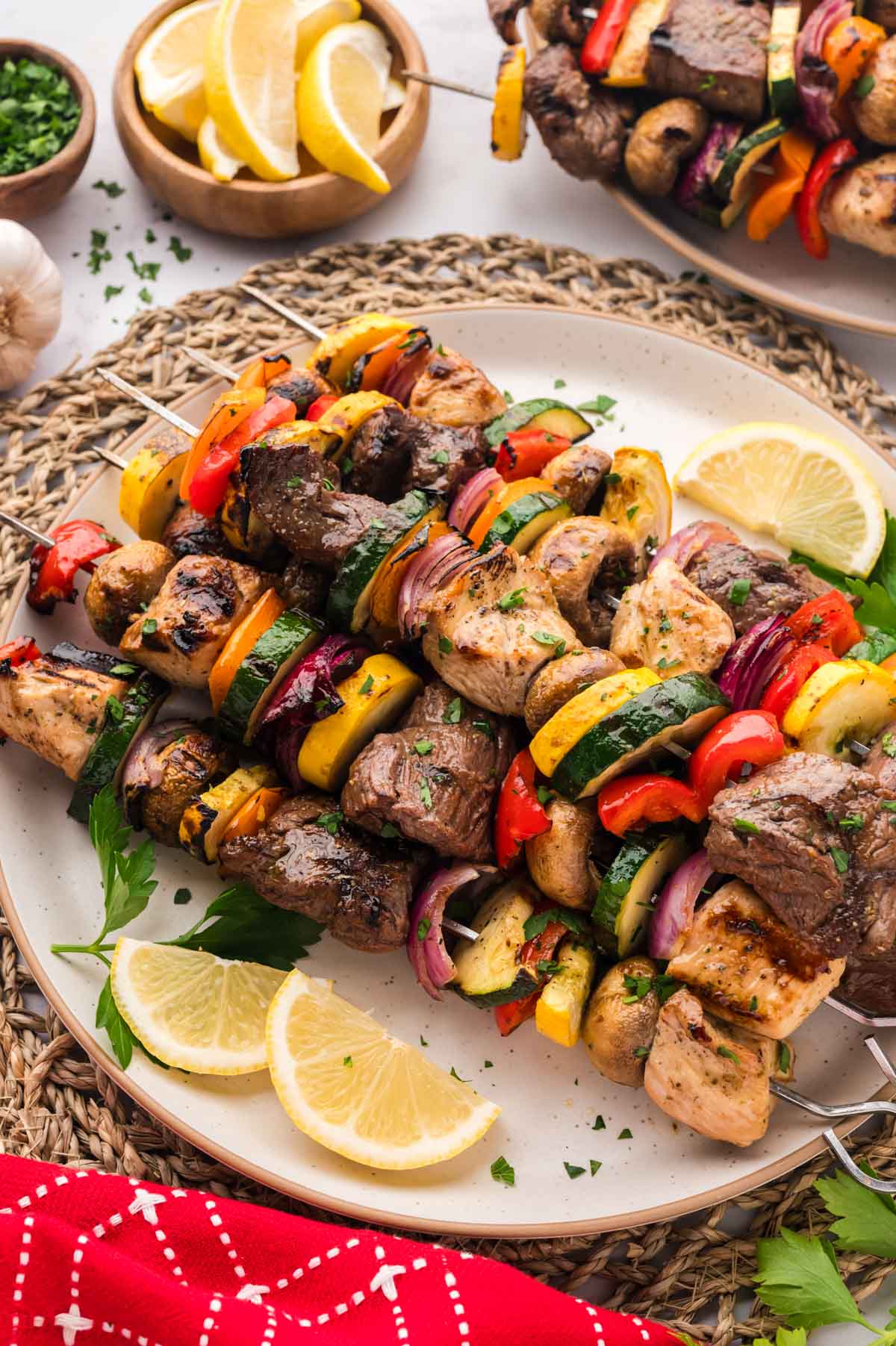 A latter of grilled steak and chicken kabobs made with shish kabob marinade.