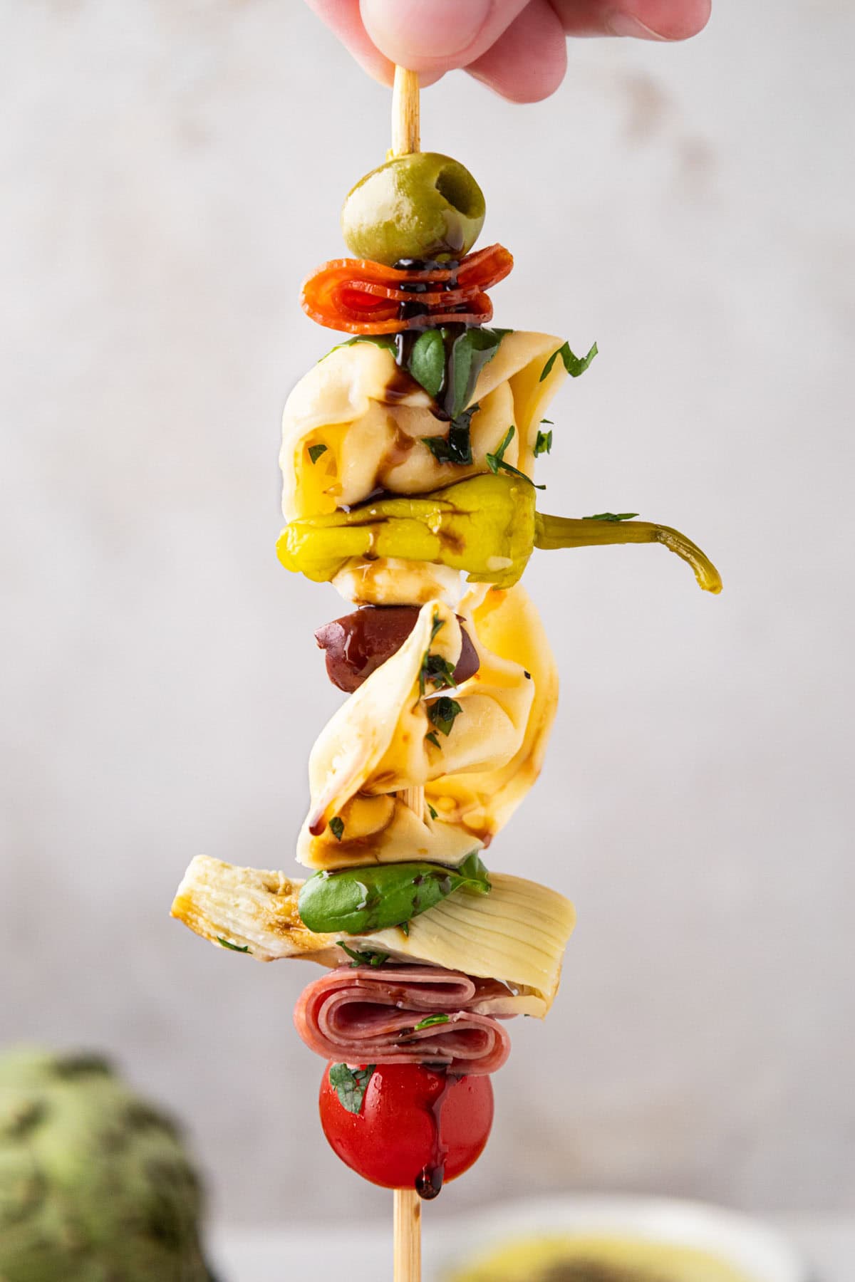 A antipasto skewer help up so you can see each layer.