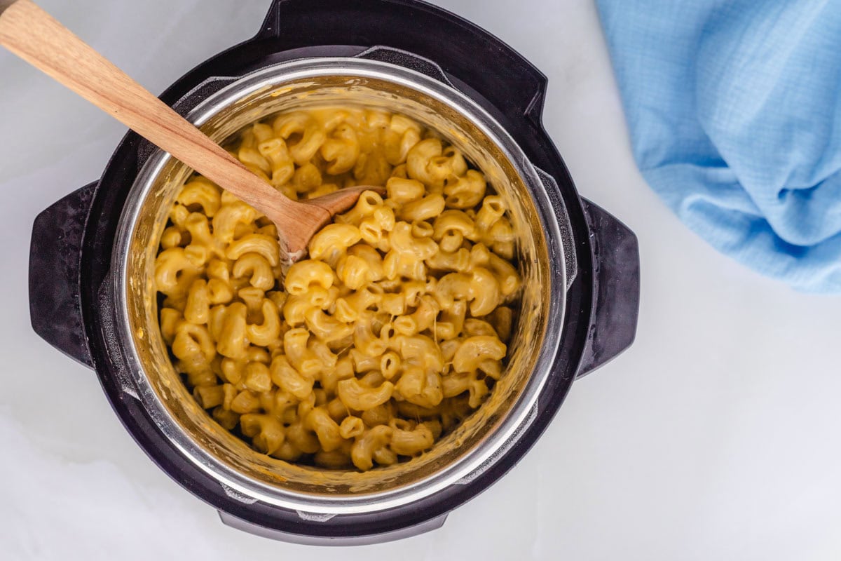 Heavy cream and cheese stirred into noodles to make creamy mac and cheese in the instant pot.