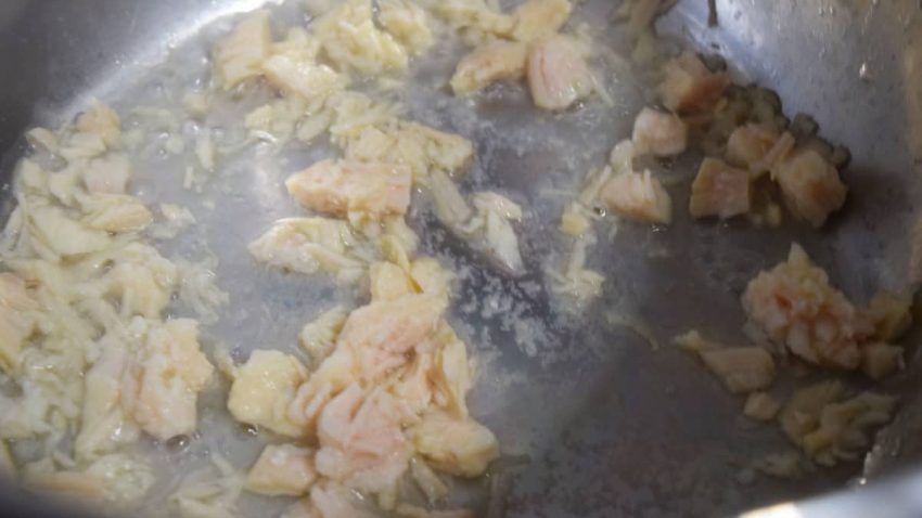 chopped chicken sautéing in a sauce pan for this chicken and rice recipe