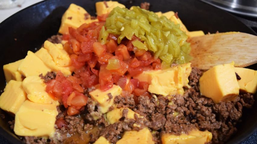 a closeup of all of the ingredients for this skillet beef queso dip recipe