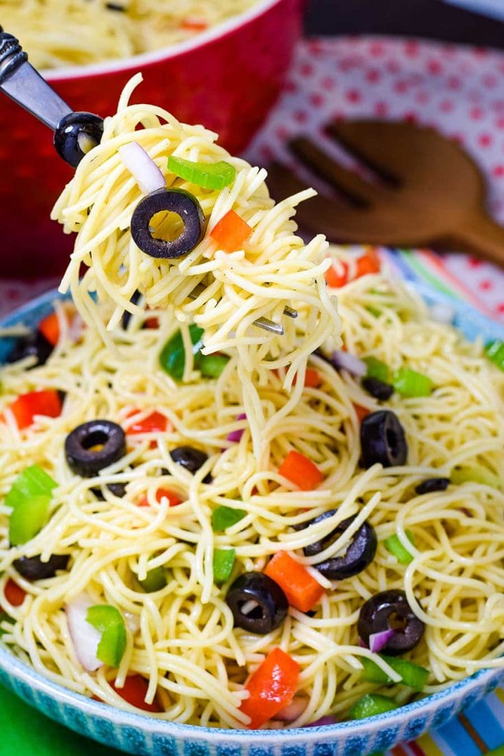 Fork Full of Spaghetti Pasta Salad with Fresh Veggies in a BLue Bowl