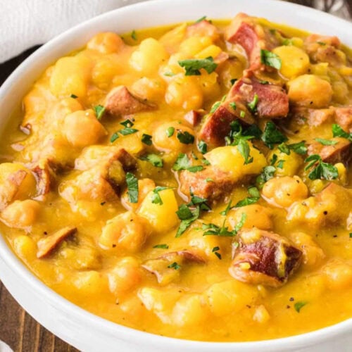 Closeup shot of spanish bean soup in a white bowl