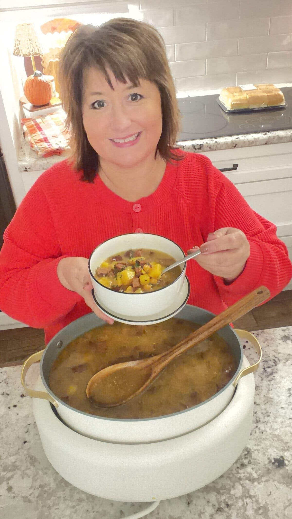 Nikki in her kitchen making Spanish bean soup.