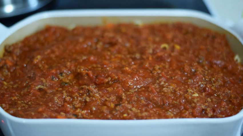 the second layer of the tomato meat sauce for this ultimate baked spaghetti recipe