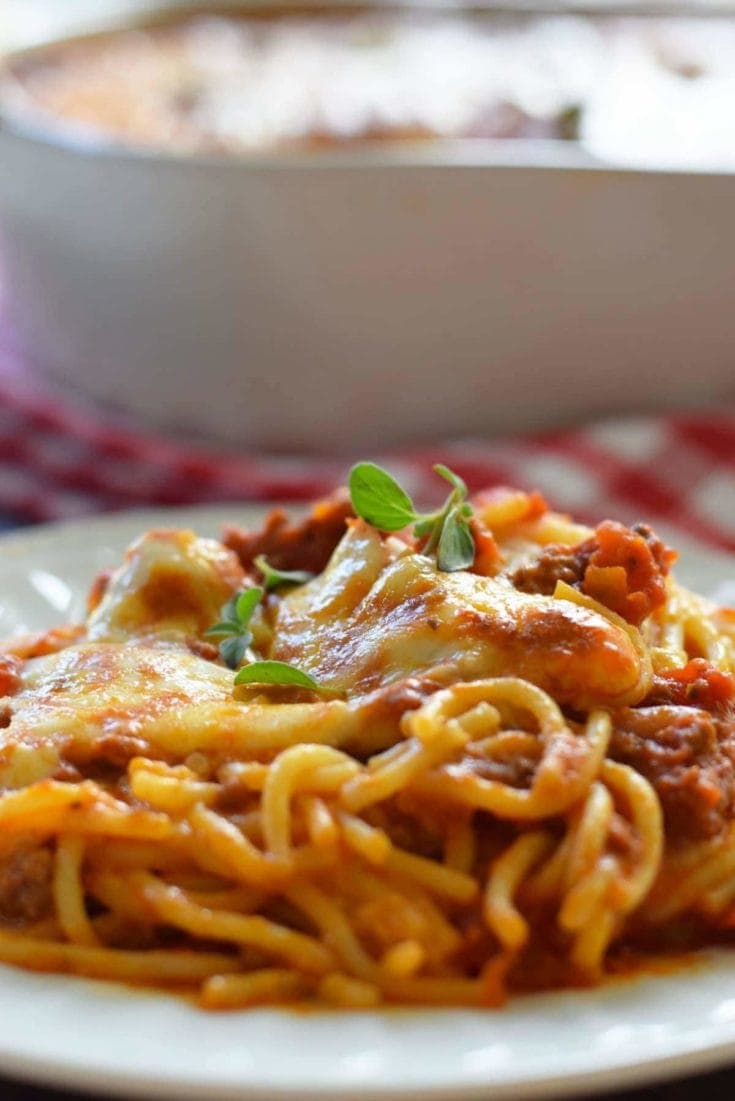 a closeup of a serving of this ultimate baked spaghetti