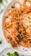 Zoom your thoughts in on a pasta with red sauce and topped with cheese for this Ultimate Baked Spaghetti recipe.