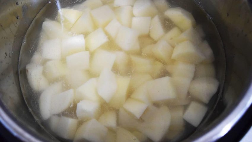 a closeup of uncooked chopped white potatoes for this instant pot mashed potatoes recipe