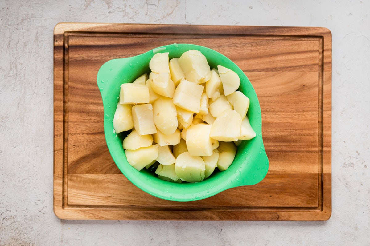 Drained cooked potatoes in a colander.