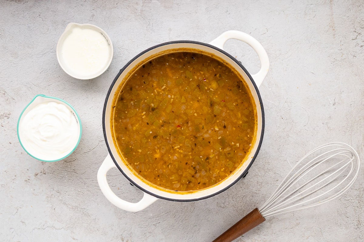 White chicken chili simmering in a dutch oven.