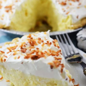 a close up of a slice of this easy coconut cream pie with toasted coconut