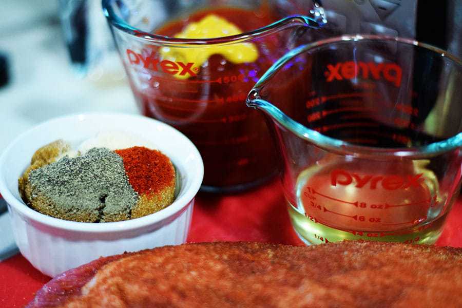 all of the wet and dry ingredients needed to make this slow cooker beef brisket