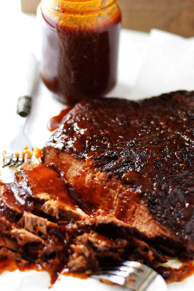 this tender sliced slow cooker beef brisket glazed with homemade barbecue sauce