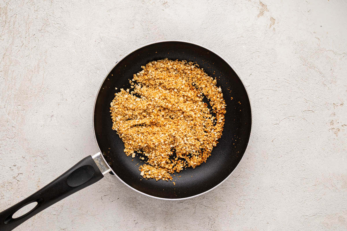 Toasted Italian breadcrumbs and panko crumbs in a skillet.