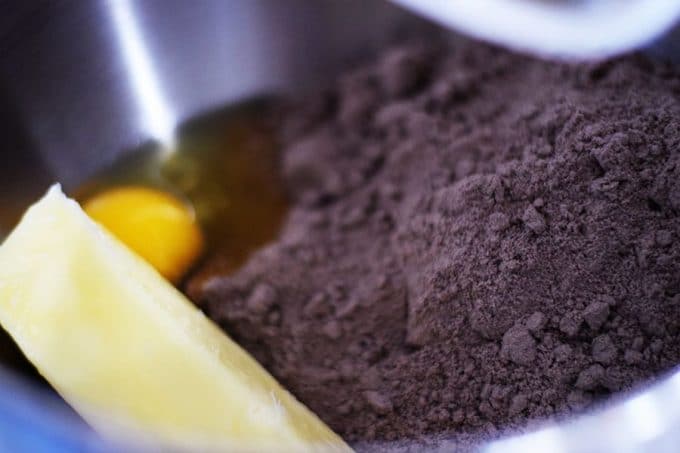 the dry ingredients and an egg used to make these chocolate oreo peppermint cake mix cookies 