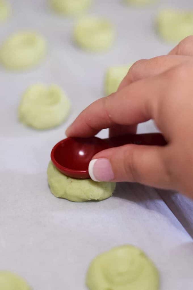 Pressing Pistachio Wedding Cookie before baking