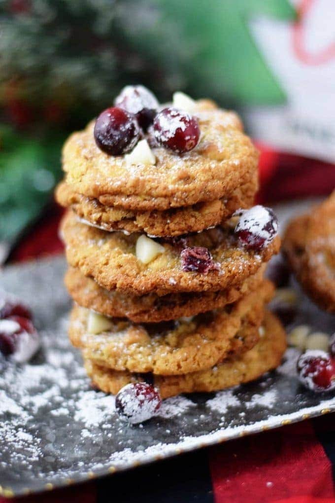 A stack of candied cranberry walnut oatmeal cookies for Christmas