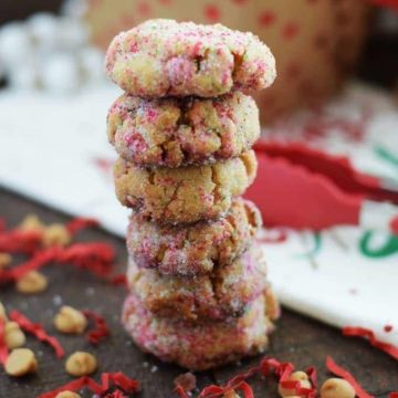 a stack of peanut butter fudge cookies with red and white sprinkles for Christmas