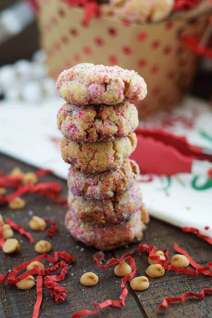 a stack of peanut butter fudge cookies with red and white sprinkles for Christmas
