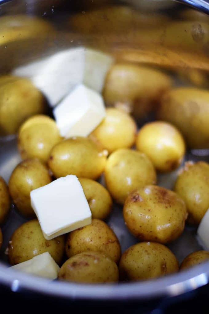 a closeup of baby potatoes in a pressure cooker for this instant pot meatloaf and potatoes
